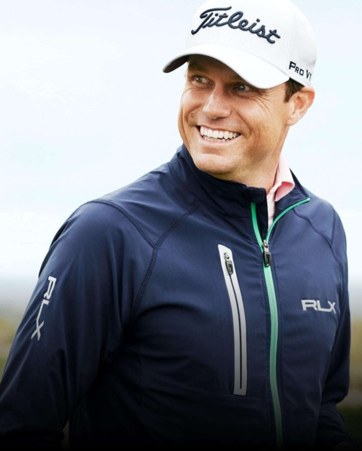 Photo of Nick Watney in navy zip-up RLX jacket.