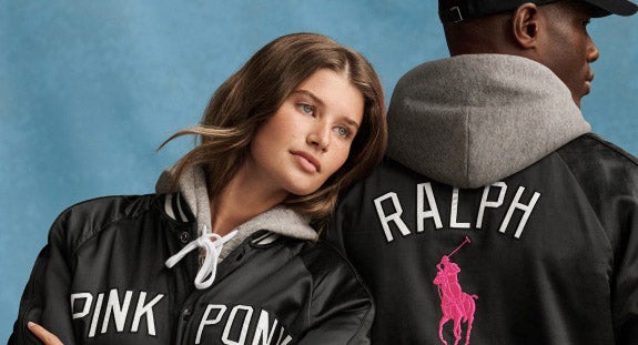Man and woman in black and pink Pink Pony attire.