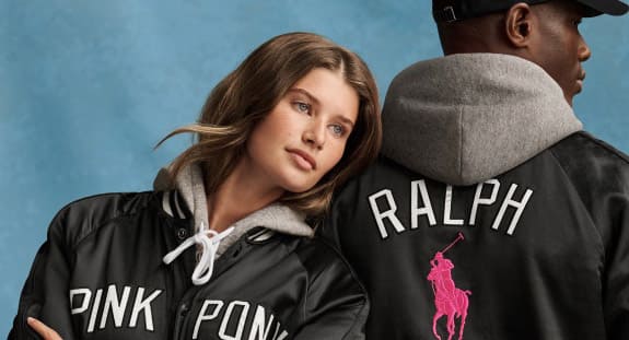 Man and woman in black and pink Pink Pony attire.