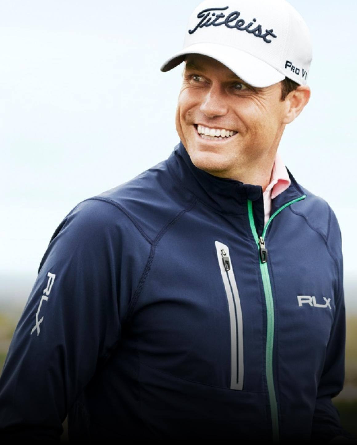 Photo of Nick Watney in navy zip-up RLX jacket.