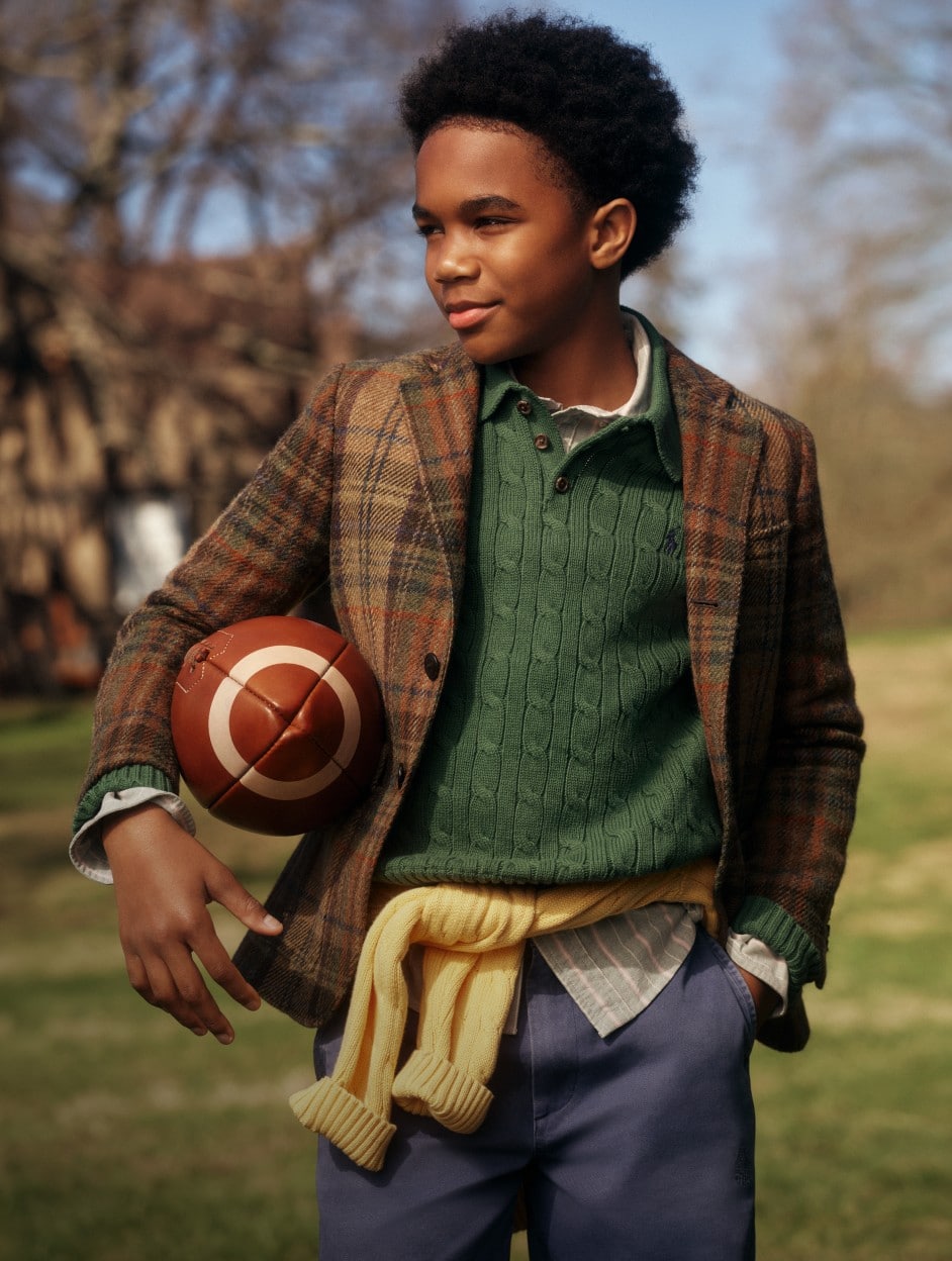 Man wears a brown sport coat over a Fair Isle sweater.