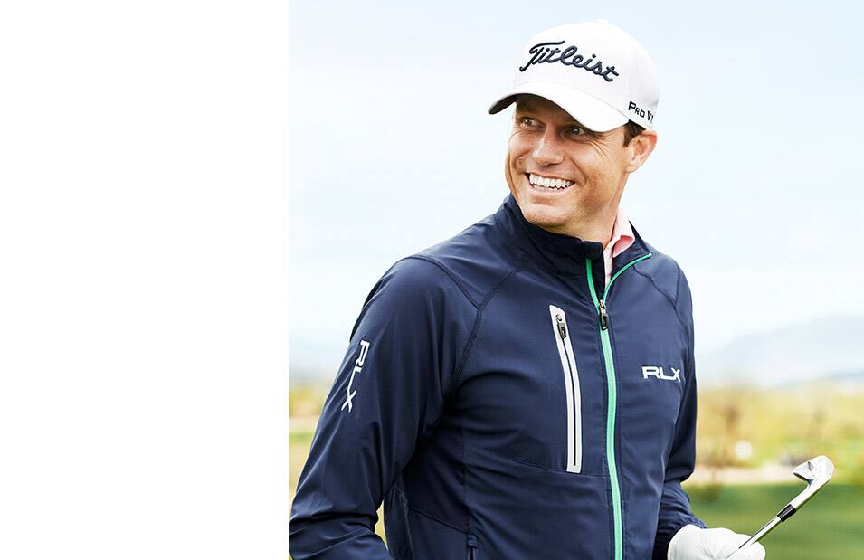 Doc Redman wears neutral-hued quarter-zip sweatshirt.